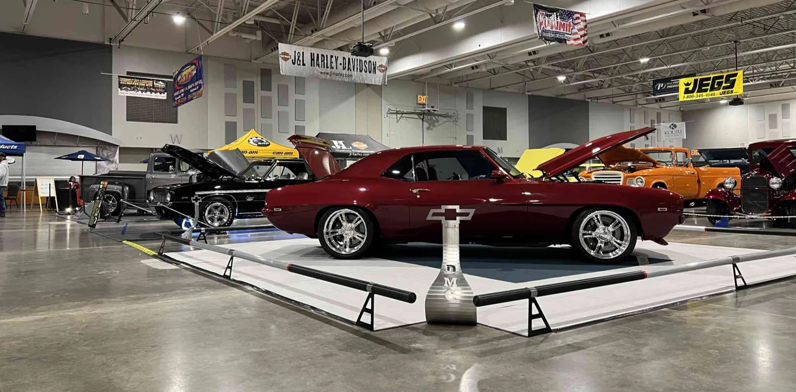The Heavy Metal Camaro displayed at an indoor car show