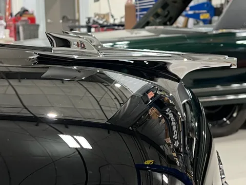 Close-up of the chrome hood ornament on the 56